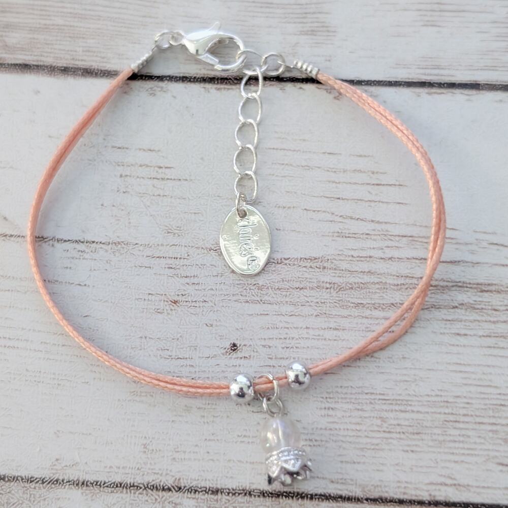 Claires Bracelet - Light Peachy Pink Tone with Charm